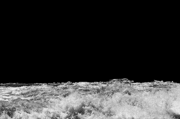 Sea wave with foam isolated on black background