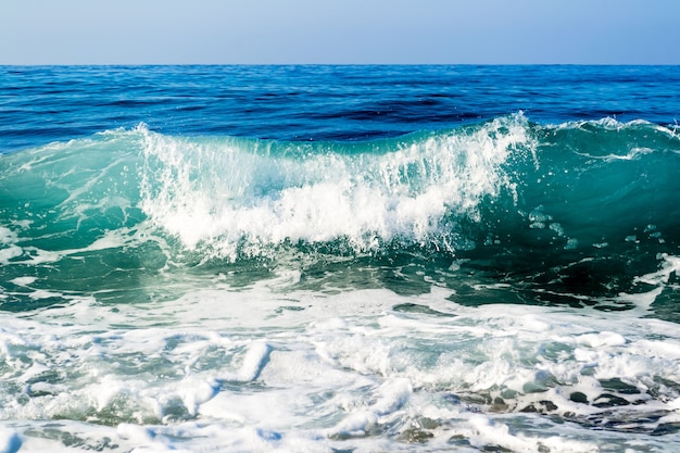 Sea waves breaking on a stony beach