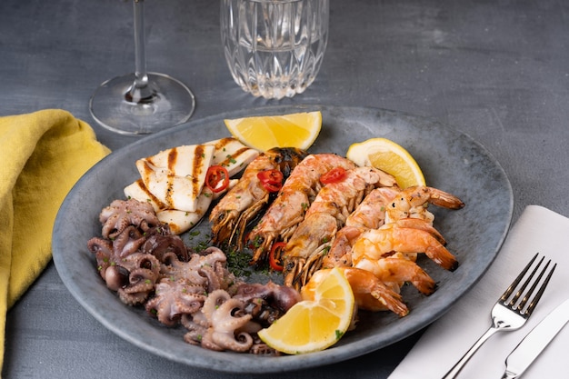 Seafood assorted platter  prawn shrimp squid octopus mini lemon  high quality photo