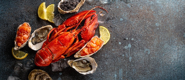 Seafood assorted with lobster oysters salmon tartare black caviar top view