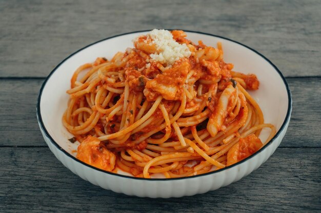 seafood marinara cuisine with grey wooden background