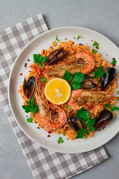 Seafood paella shrimp and mussels risotto rice homemade top view no people