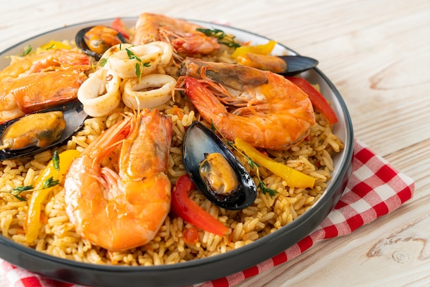 Seafood Paella with prawns, clams, mussels on saffron rice - Spanish food style