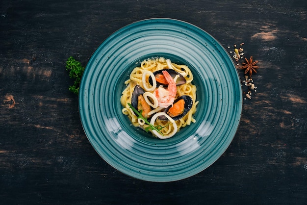 Seafood Pasta On a wooden background Italian cuisine Top view Copy space