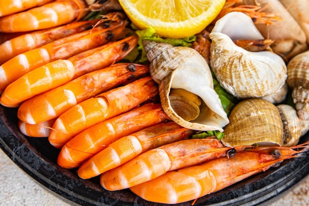 seafood plate assorted shrimps, crab claws, clams, rapan, trumpeter mollusk Takeaway healthy meal