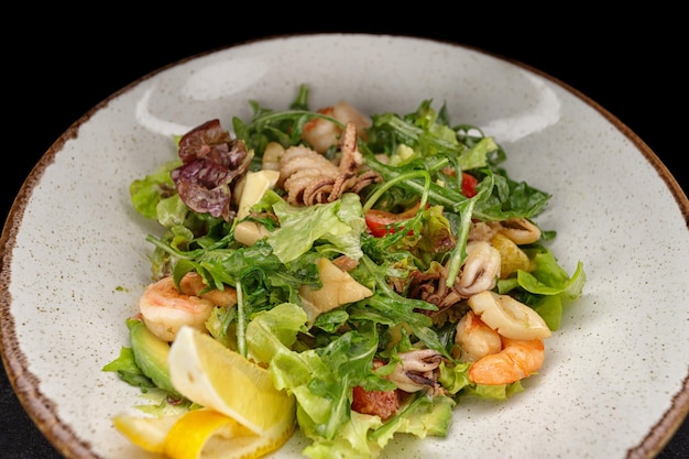 Seafood salad octopus shrimp scallop squid and mixed greens