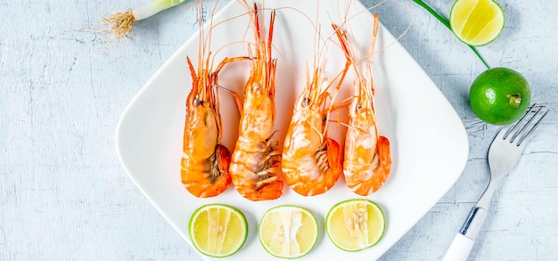 Seafood shrimp menu in a plate on a white table