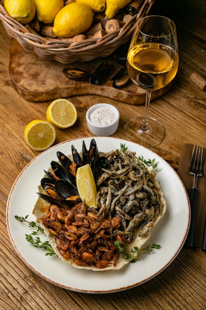 Seafood with lemons on a wooden table