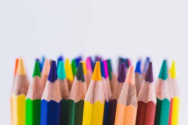 Seamless colored pencils row isolated on white background