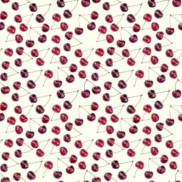 Photo seamless endless pattern of bright ripe red sweet cherries, isolated on white background