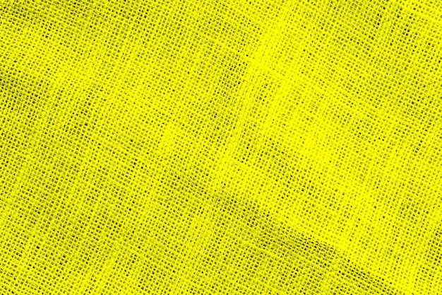 Seamless grunge textured yellow sackcloth fabric background