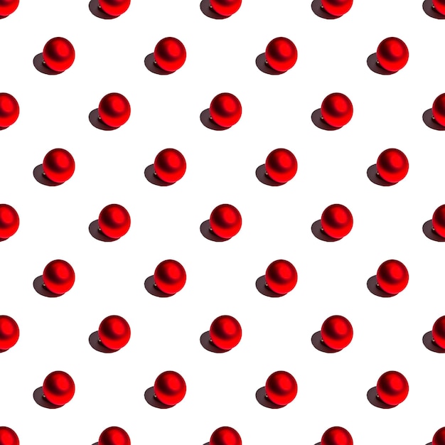 Seamless minimalistic pattern of red Christmas balls on a white background Photo collage Christmas background wallpaper