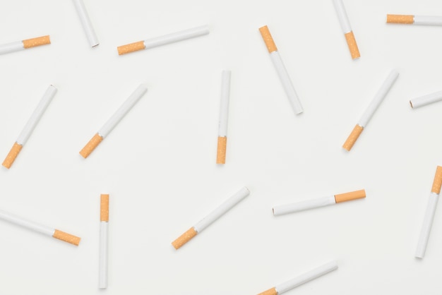 Seamless pattern of cigarettes on white background