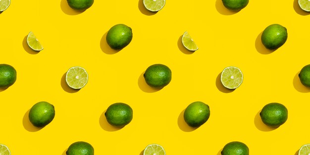 Seamless pattern from limes on a yellow background