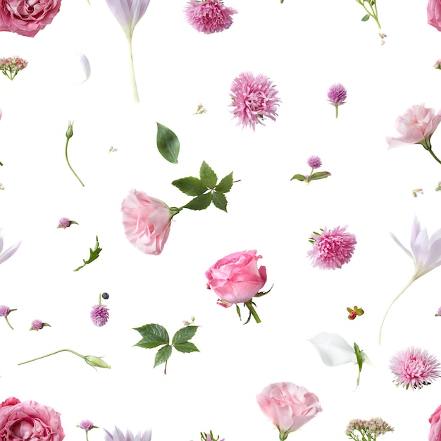 Seamless pattern of various soft flowers and leaves scattered on a white surface