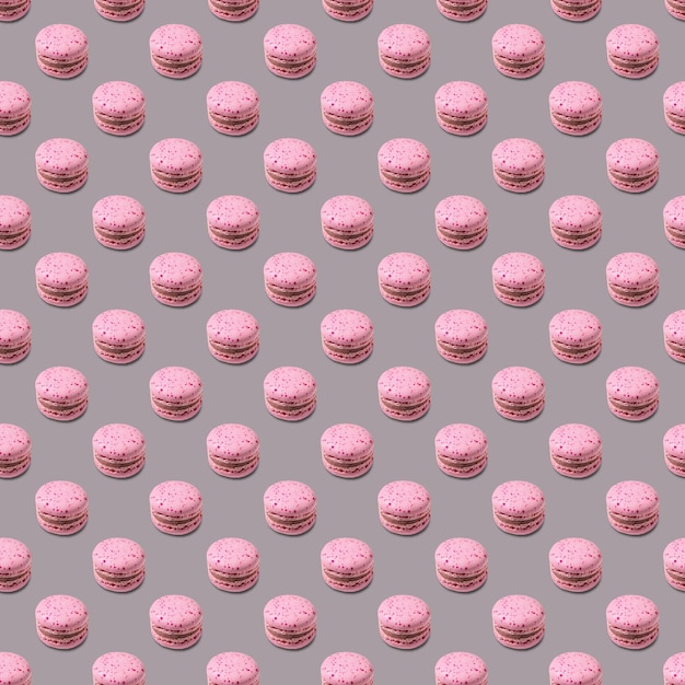 Seamless pattern with french pink macaroon on a gray background