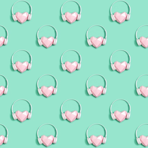 Photo seamless pattern with paper pink heart in white headphones, concept for music festivals, radio stations, music lovers