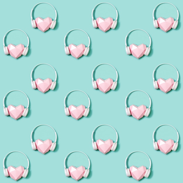 Photo seamless pattern with volumetric paper pink heart in white headphones