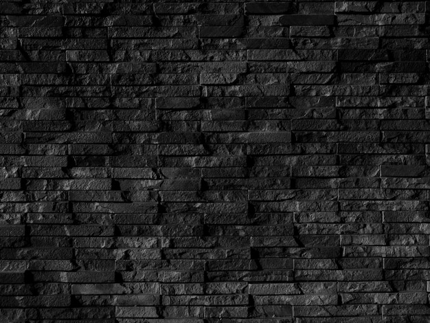 Seamless texture of black brick stone wall a rough surface with space for text for a backgroundx9