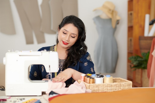 Seamstress Working on Sewing Machine