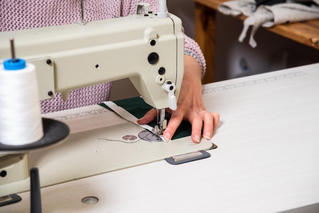 Seamstress works in the tailoring workshop