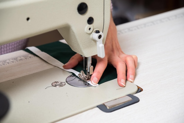 Seamstress works in the tailoring workshop