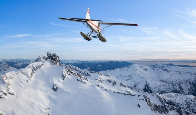 Seaplane flying over the Rocky Mountains