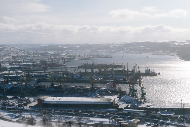 Seaport, many cargo ships, water in the sun