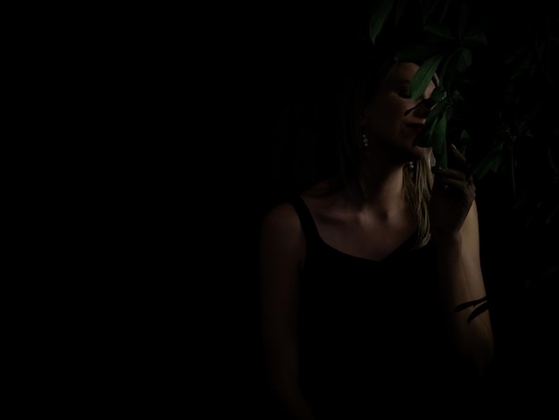 Photo in search of inner femininity and sensuality game of light portrait of a woman in a low light