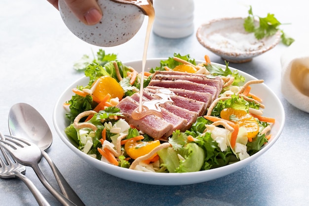 Seared tuna with asian crunchy salad with oranges