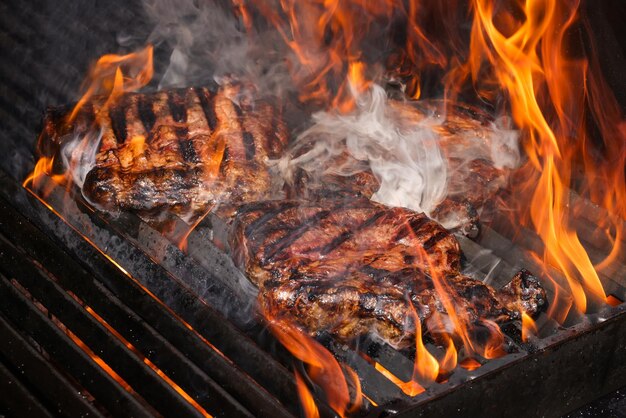 Searing and smoking ribeye steaks on grill