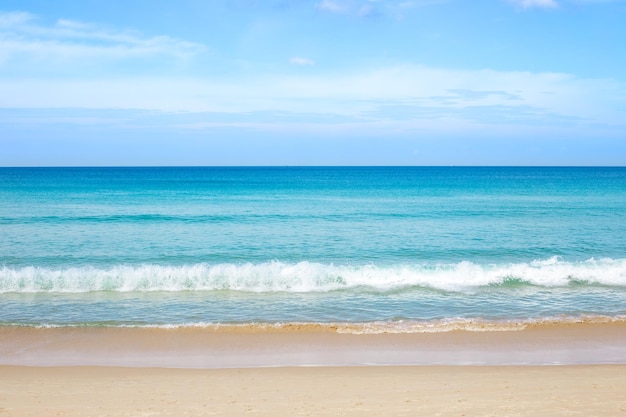 Seascape clear azure sea with sandy beach and blue sky on the horizon travel and tourism sea