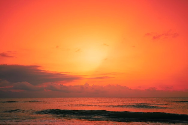 Seascape in early morning orange sunrise over the sea Nature landscape