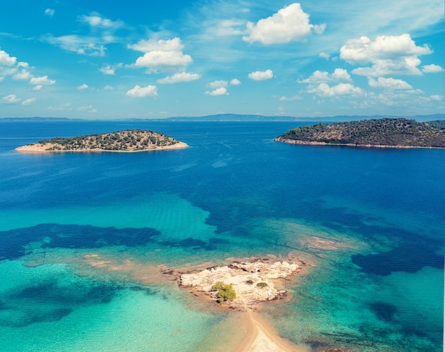 Seascape on a sunny day view from above with a beautiful bay Lagonisi beach in Greece