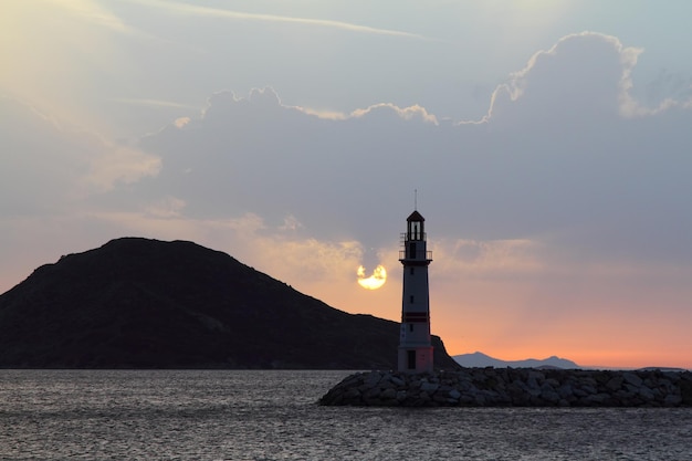 Seascape at sunshine Lighthouse and sailings on the coast Seaside town of Turgutreis and spectacular sunshine