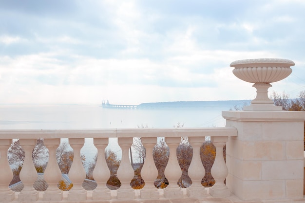 Seascape. View of the Crimean bridge in the fog from the observation deck on the stairs.