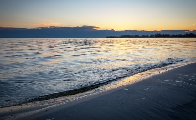 Seascape with blue sky and sea. Beach at dawn