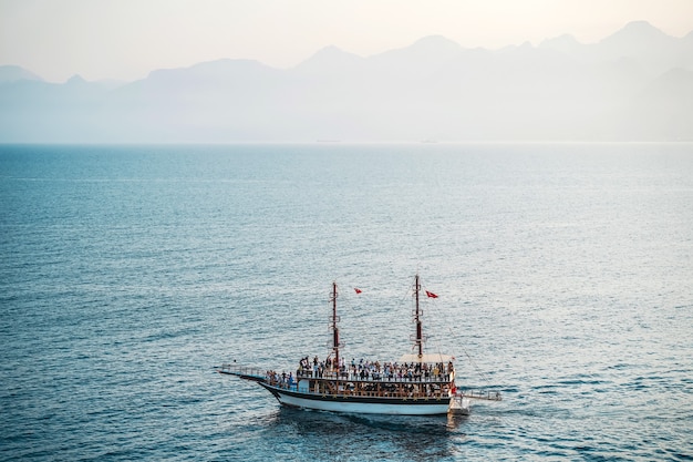 Seascape with a lonely ship in the mediterranean boat trip on a tourist ship sights and travels of t...