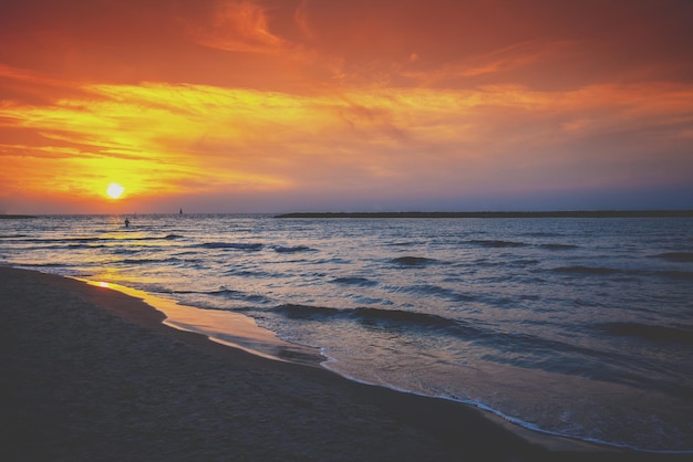 Seashore in the evening Sunset over the sea Beautiful beach with dramatic sunset sky