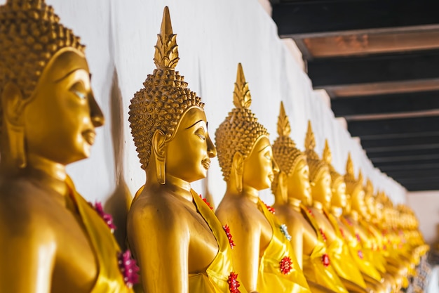 Seated Golden Buddha Statues In A Row AtWat Phutthaisawan, Temple Of The Reclining Buddha Ayutthaya Thailand