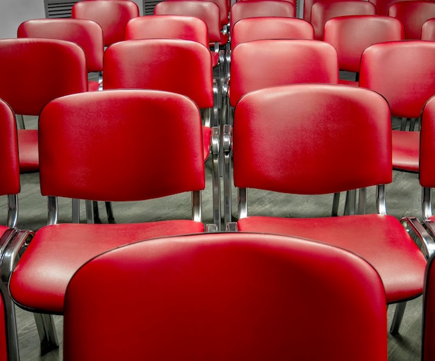 Seats in the audience for conference participants Holding mass events Classic empty chairs in a row