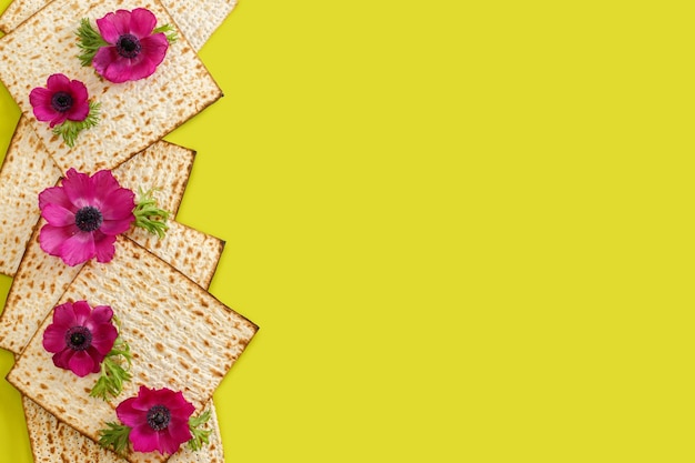 Seder Pesach celebration concept jewish Passover holiday Matzah and flowers Top view