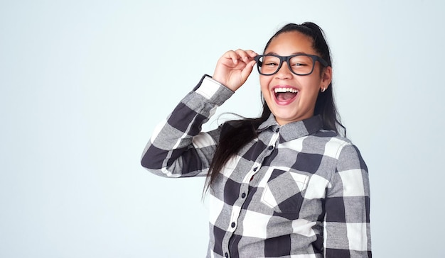 See the happiness in every day Studio portrait of a cute and confident young girl posing against a gray background