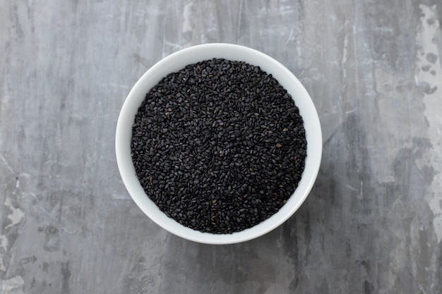 Seeds of black sesame in the white bowl