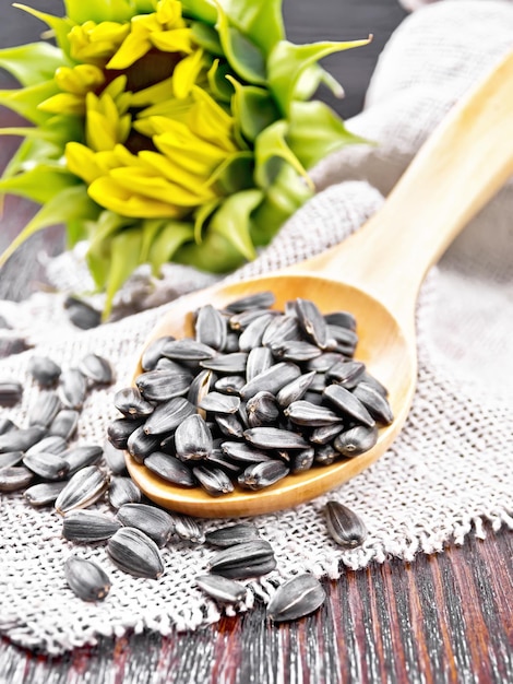 Seeds sunflower in spoon on board