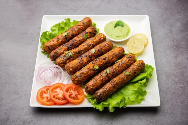 Seekh Kabab made with minced chicken or Mutton keema, served with green chutney and salad