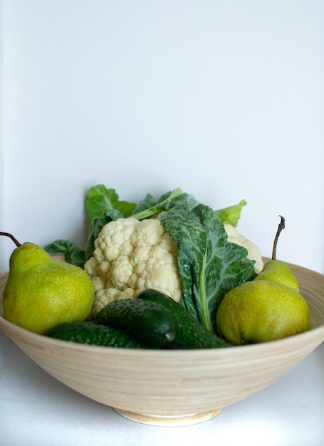 Selected cucumbers cauliflower and pears in a salad bowl