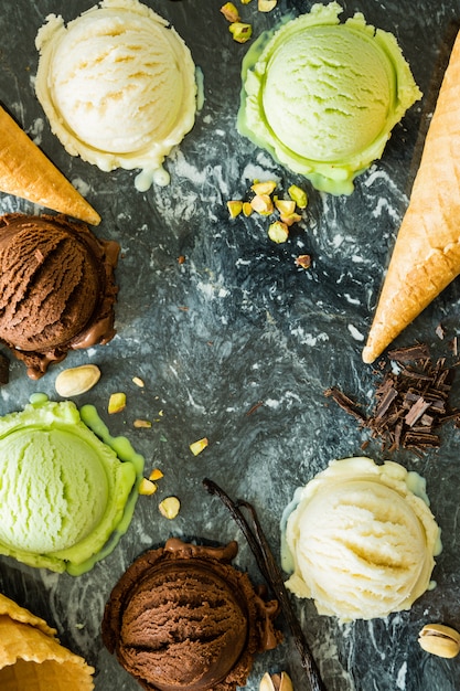 Selection of colorful ice cream scoops in white bowls