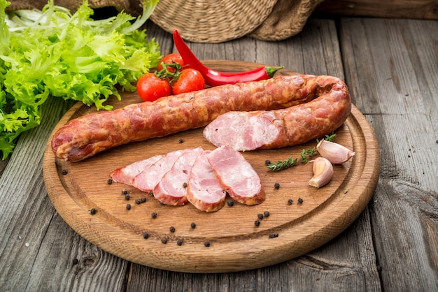 Selection of different types of salami. Organic products on a wooden table