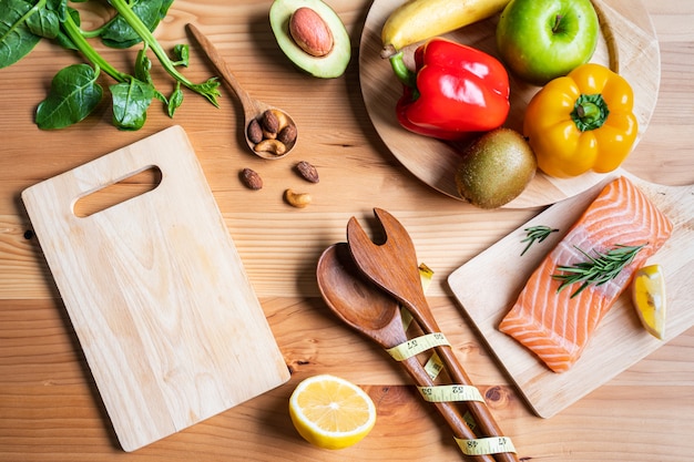 Selection of healthy food for heart on wooden table